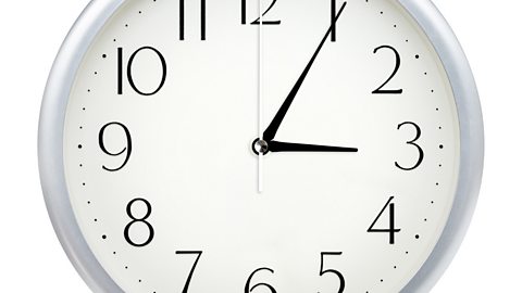 Image of a clock face showing 3.05