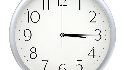 Image of a clock face showing 3.15