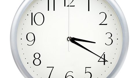 Image of a clock face showing 3.20