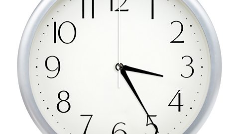 Image of a clock face showing 3.25