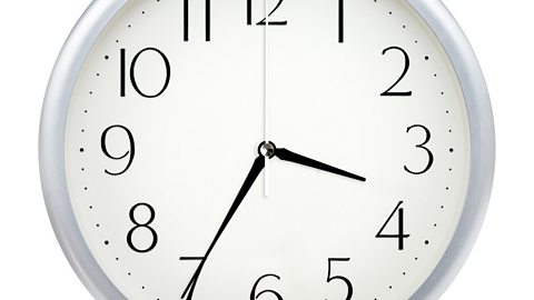 Image of a clock face showing 3.35