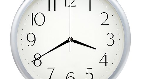 Image of a clock face showing 3.40