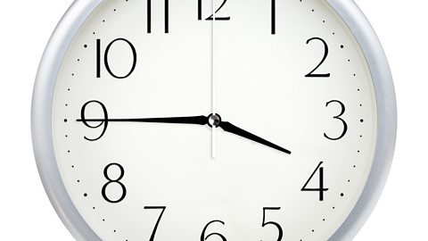 Image of a clock face showing 3.45