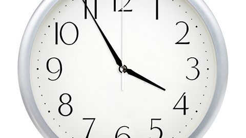 Image of a clock face showing 3.55