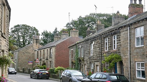 A photo of a row of houses in a village