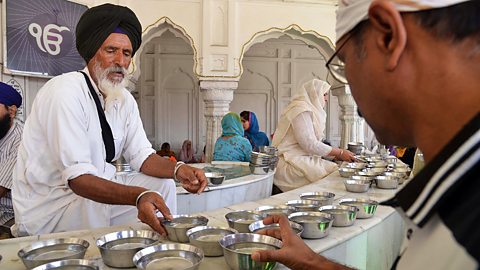 Sikhism – Volunteers distribute water at the Golden Temple, Amritsar