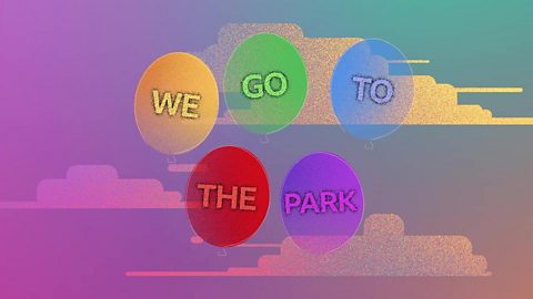 The words 'we go to the park' written on balloons.