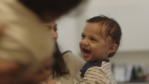 Close up of toddler laughing.