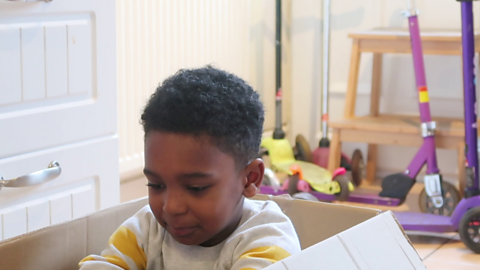 Boy sat in box