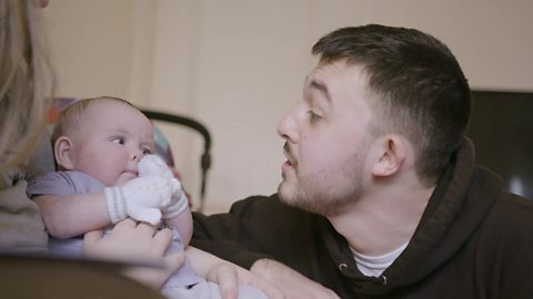 Dad and baby looking at each other