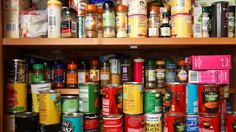 Food cupboard with packets and tins