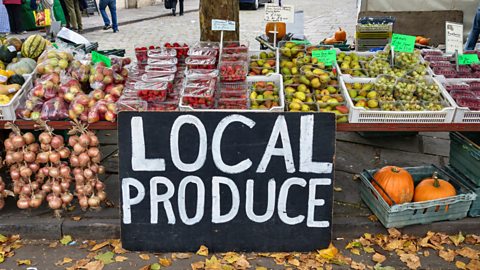 Local produce sign at a fruit and veg market