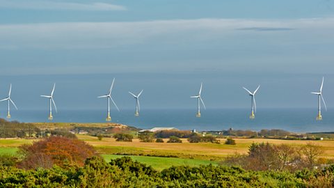 A view of seven wind turbines