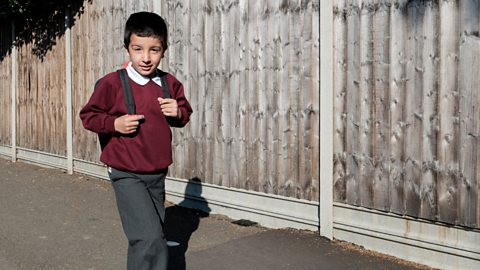  Child walking to school in uniform