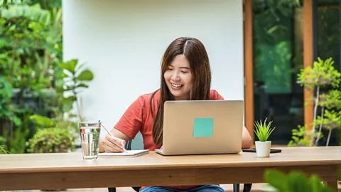 File image of a woman working in a leafy garden