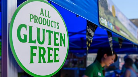 Sign at a market that says 'All products gluten free'