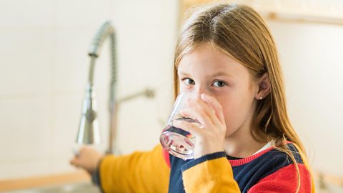 9-year-old girl drinking tap water