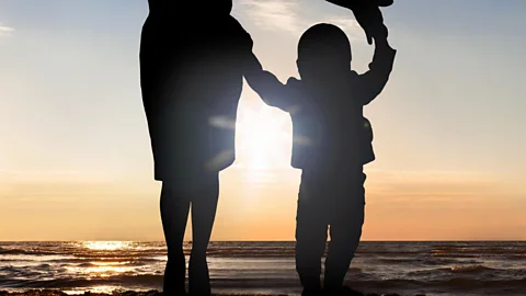 File image of the silhouettes of a mother and child