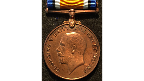 A photograph of a bronze British War Medal.