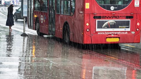 Passenger waiting for the bus in the rain