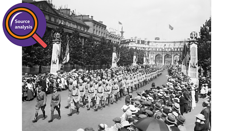 Crowds gather to watch soldiers from the British Empire at peace parades in London.