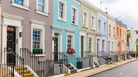 Street in residential district with row houses in London