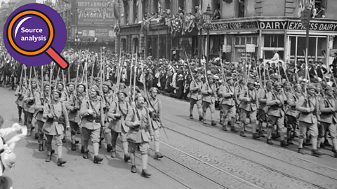 Regiments from Czechoslovakia marching past rows and rows of crowds. 