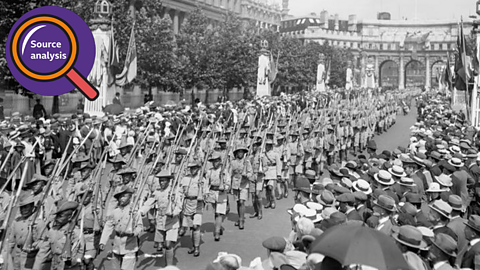 Gurkha troops passing crowds and heading towards Buckingham Palace.