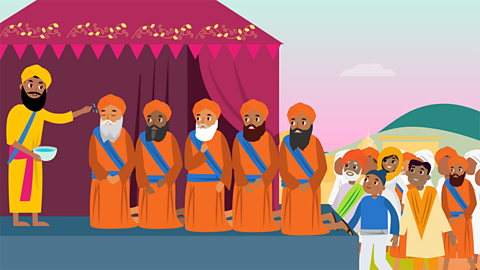 Guru Gobind Singh then baptised all the men into the Khalsa. He said some prayers and sprinkled them all with sugar water called amrit. These five men became the first members of the Khalsa.