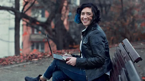 File image of a woman sitting at a desk