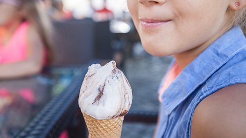 Closeup of child eating ice cream 