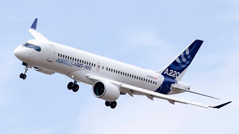 A Boeing A220 in the air