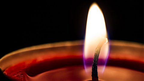 A lit candle. The chemical store in the candle wax and the oxygen in the air is full before this candle is lit.