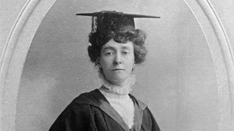 A portrait of Emily Davison wearing her graduation cap. 