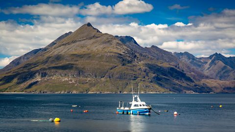 Fishing boat and the Black Cuillin Mountains