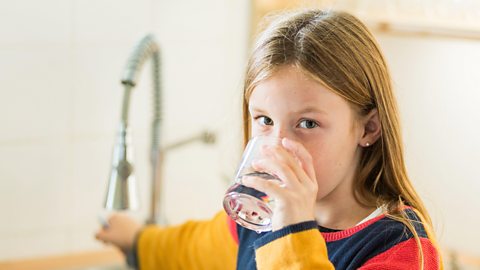 A girl drinking tap water