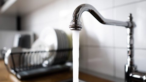 A kitchen tap running