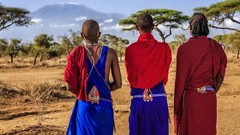 Maasai tribesmen with Mount Kilimanjaro on the background, Kenya