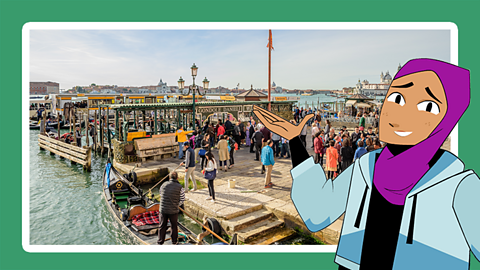 Lots of people milling around on a pier in Venice, Italy