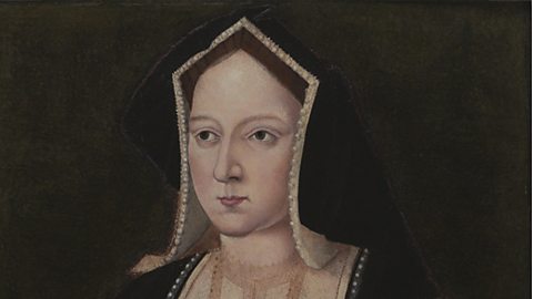 A portrait of Catherine of Aragon, who is wearing a black headdress with a white trim, and pearls around the edge. 