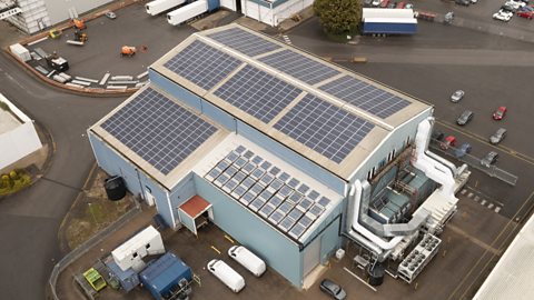 Factory with solar panels on top