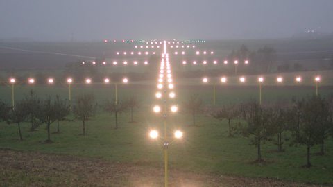 Lights on an airport runway that help guide planes in heavy fog.