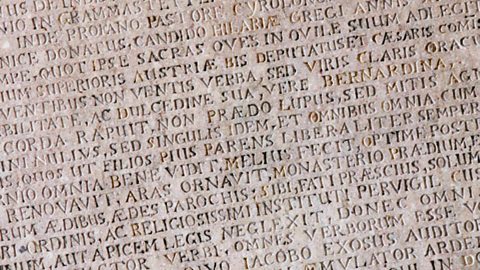 An image of roman lettering engraved in stone