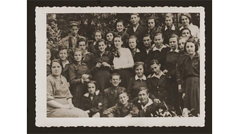 A black and white photograph of students at school in Zamosc, Poland.