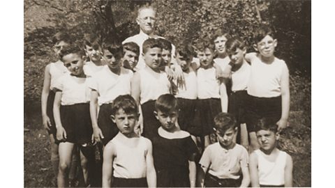 A black and white photograph of boys who were members of a sports club.