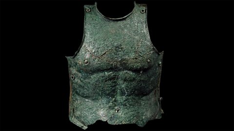 A piece of armour made from one piece of metal that covers the area of a chest and upper stomach.
