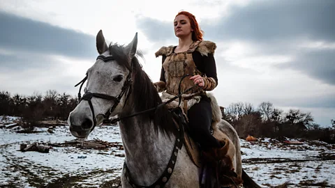 A Viking woman on horseback.