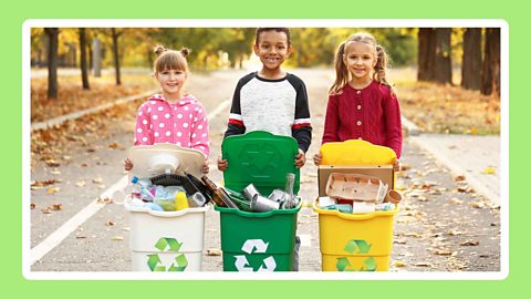 Three children with full recycling bins