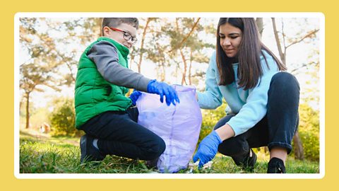 A boy and a woman litter picking