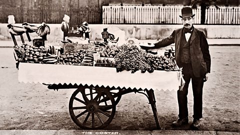 A greengrocer selling fruit and vegetables. 